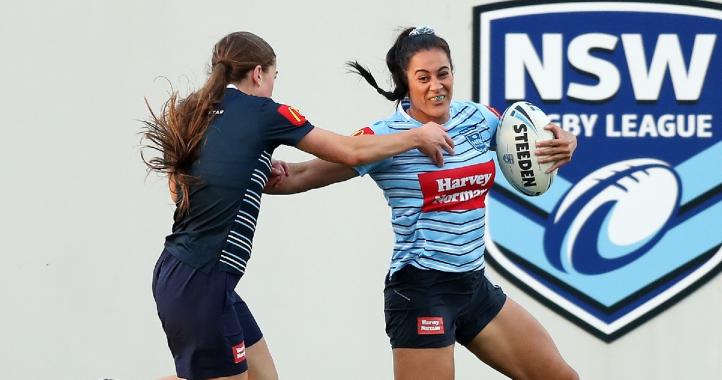 women-playing-rugby-league
