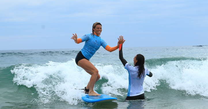 Women surfing in the ocean